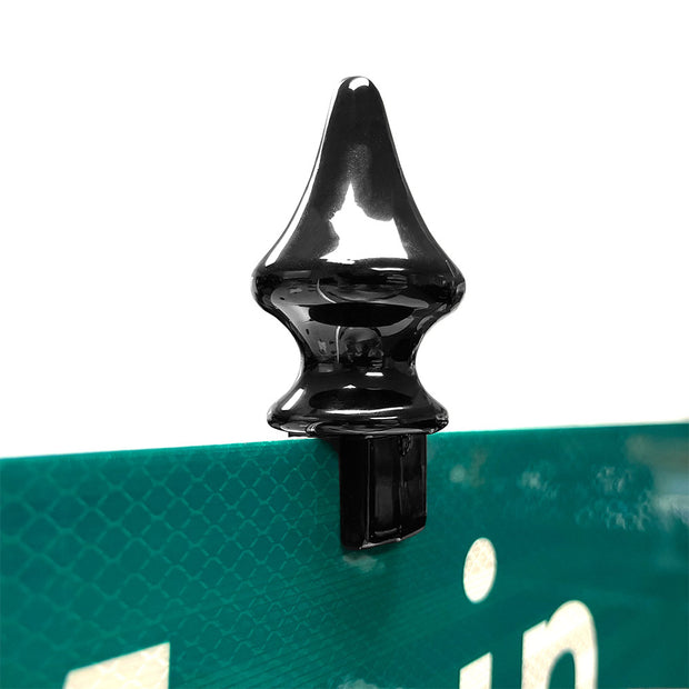 Spike finial street-blade topper. Powder-coated black shown mounted to traffic green reflective street-blade.