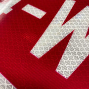 close up image of red printed on reflective white vinyl