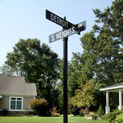 black and white street name signs mounted to a decorative post with a classic stack mounting set