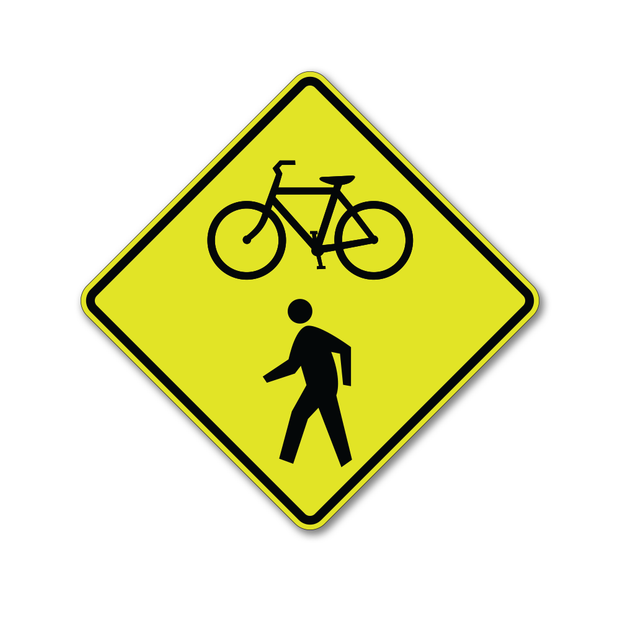 florescent yellow-green bikes and pedestrian warning sign, diamond shaped caution sign