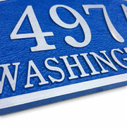 14" x 9" bell shaped oval aluminum door number plaque with blue finish, angled to show texture