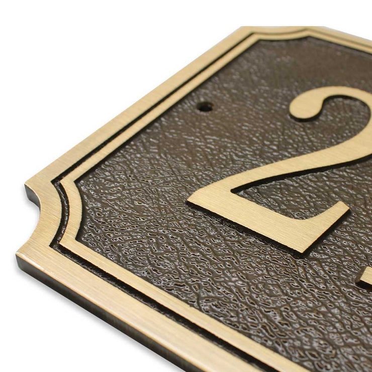 Close-up view of a 14" x 9" Scalloped bronze house number plaque