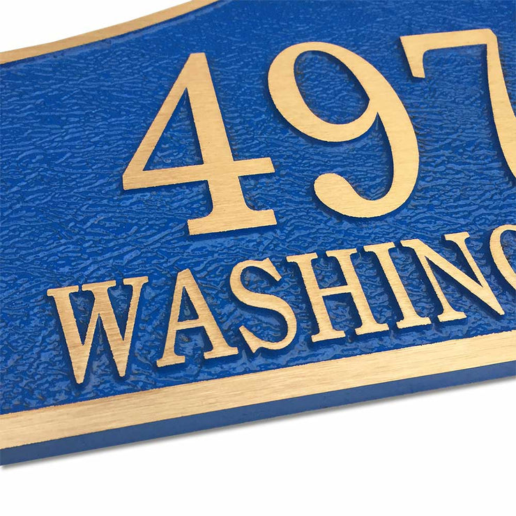 14" x 9" bell shaped bronze door number plaque with blue finish, angled to show texture