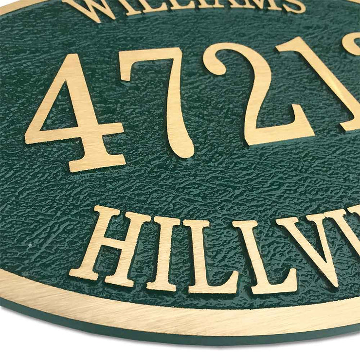 14" x 10" oval bronze door number plaque with green finish, angled to show texture