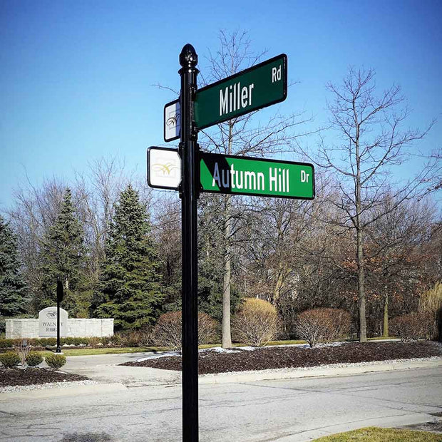 image of street signs that include the logo paddle with trim for a decorative luxury street sign assembly