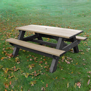 standard picnic table with umbrella hole, located in grassy field